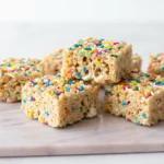 Classic Rice Krispie treats made with crispy rice cereal and melted marshmallows.