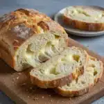 Freshly baked cheese bread with a golden crust and melted cheese on top.