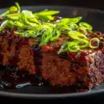 Korean BBQ meatloaf glazed with a sweet and savory Korean-style barbecue sauce.