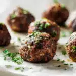 Mexican Donkey Balls made with seasoned beef and cheese, rolled into balls and cooked until golden