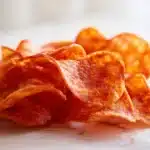 Pepperoni chips baked until crispy and curled, served on a plate