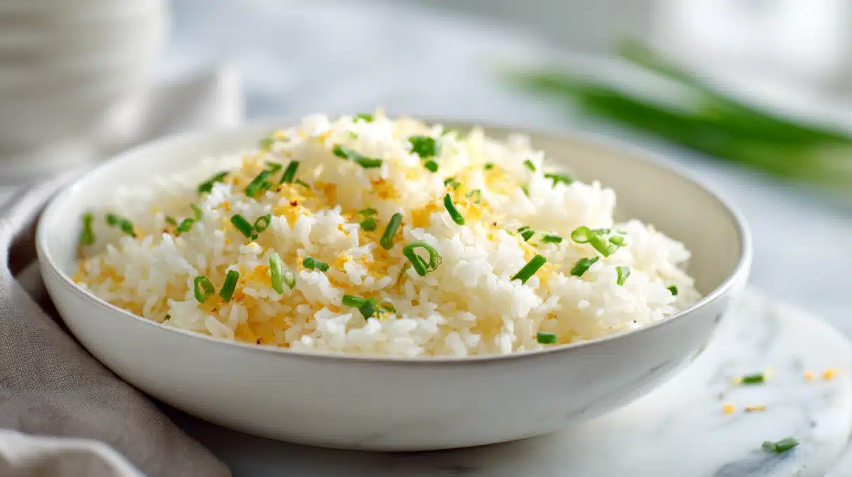 Cheesy rice with melted cheese stirred into fluffy rice, served in a bowl