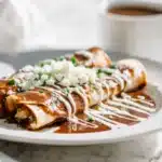 Authentic Enmoladas 7 Enmoladas tortillas filled and topped with rich mole sauce and cheese