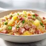 Hawaiian fried rice with pineapple, ham, vegetables, and fluffy rice in a bowl