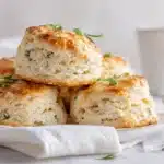 Savory Parsnip Scones 7 Freshly baked parsnip scones golden on the outside and tender inside, served on a plate with a light glaze.