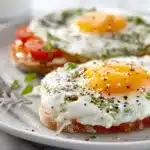 Ranch-style eggs cooked in tomato sauce with peppers, onions, and spices in a skillet