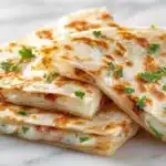 Salvadoran sweet cheese quesadillas baked until golden with soft crumb texture