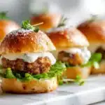 Tater tot mini cheeseburger bites with ground beef, melted cheese, and crispy tots on a tray