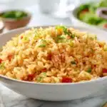 Texas Roadhouse seasoned rice with fluffy grains, spices, and herbs served in a bowl
