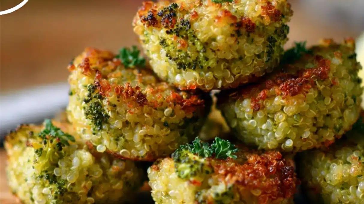 Cheesy Broccoli Quinoa Bites 4 Crispy broccoli quinoa bites baked until golden, healthy vegetable and quinoa snack served on a plate with dipping sauce.