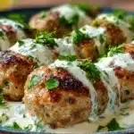 Chicken Kofta with Creamy Garlic Yogurt Sauce 6 Chicken kofta with creamy garlic yogurt sauce served with herbs and warm flatbread