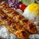 Chicken Koobideh 6 Chicken koobideh skewers grilled and served with rice, herbs, and lemon