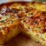 Easy Quiche Lorraine 6 Quiche Lorraine with a golden crust filled with eggs, bacon, and creamy custard