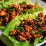 Teriyaki chicken lettuce wraps filled with juicy glazed chicken, fresh vegetables, and crisp lettuce leaves